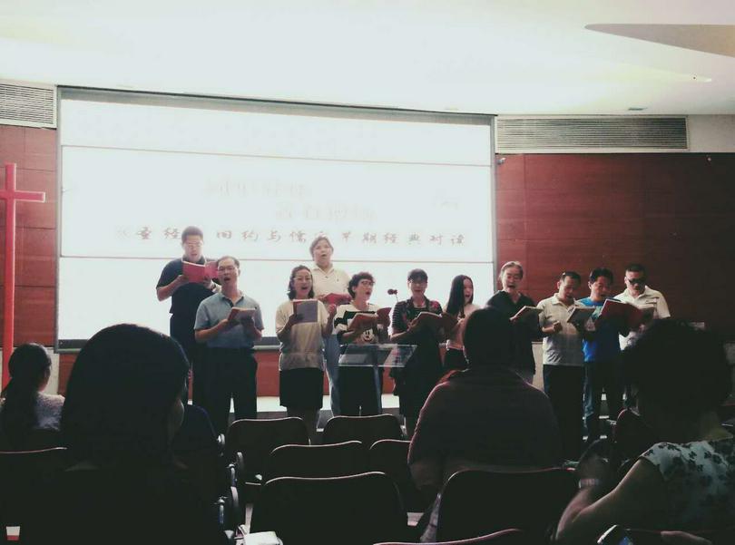 The choir sing a song before the lecture in Haidian Church 