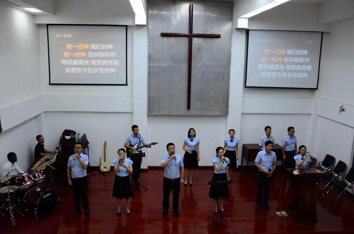 The worship and praise team consisting of young believers leads the praise part in Haixiu Church 