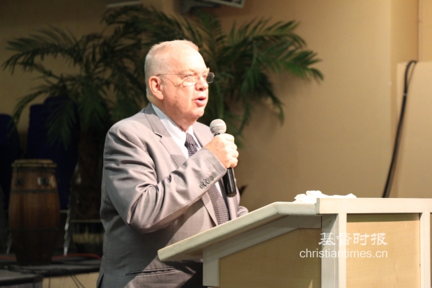 Rev. Dennis Balcombe speaks in a retreat