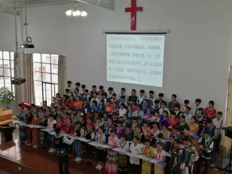 Students of Baoshan Bible School of the Nations present hymns in the chapel