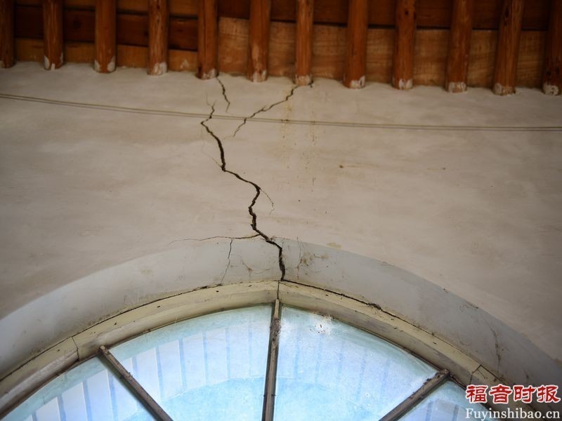 Several cracks in one side of the church walls