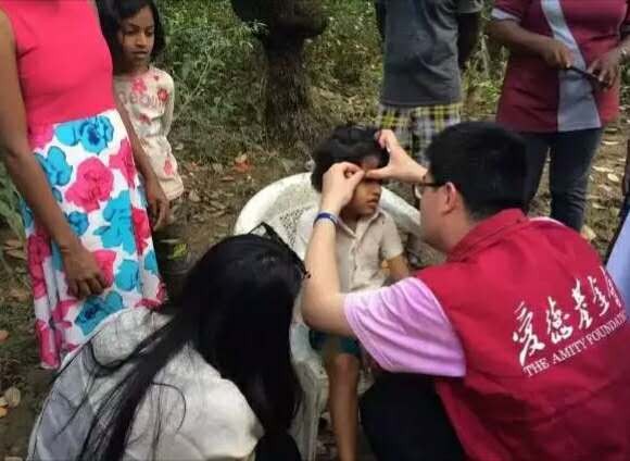 Amity staff checked a wound on a girl's face