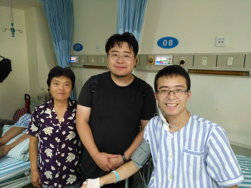 Group photo: Yu Jie (right), Rev. Zhang Kai, and Yu's mother (left)