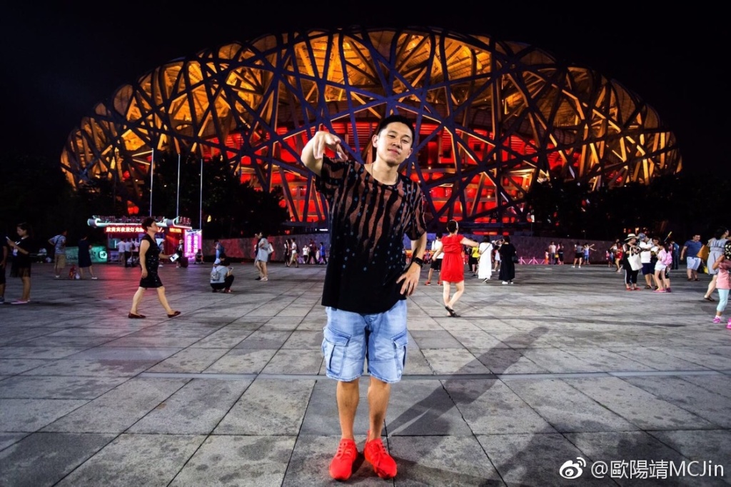 MC Jin stood before the Beijing National Stadium