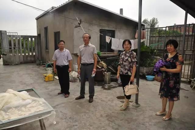 Rev. Wang and three believers visited a family in Yuxiang Village 