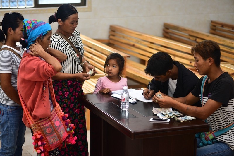 Thanksgiving day of Laku people Believers are giving tithe in the church.