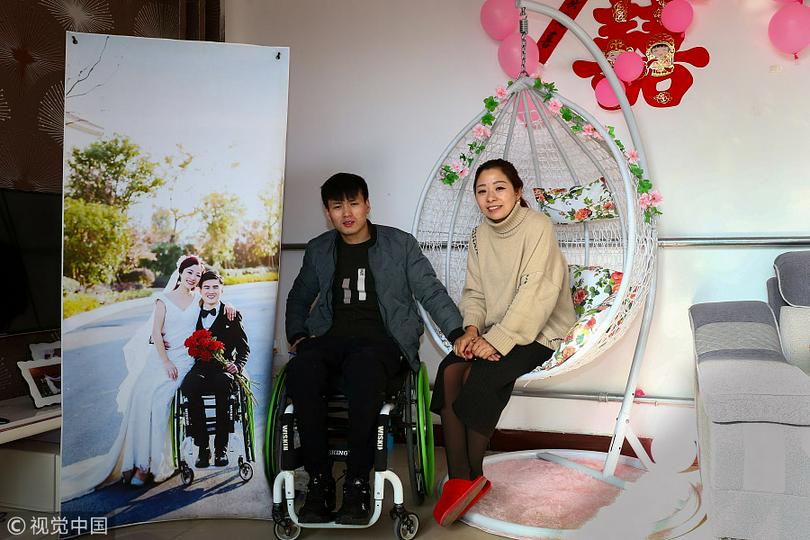 Hao Panpan (left) and Fu Chengjun pose in their wedding room in Huanggou village of Jize county in Handan, North China's Hebei province, Jan 9, 2018. 