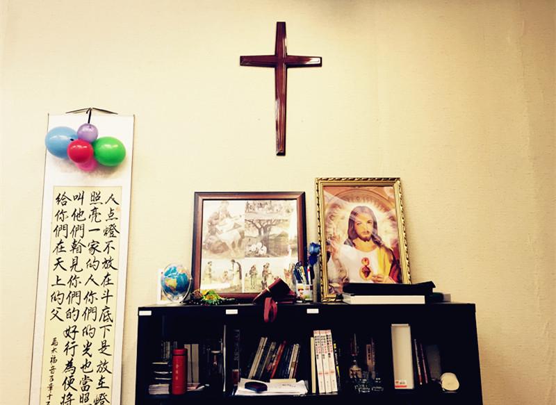 A cross is placed on the wall. 