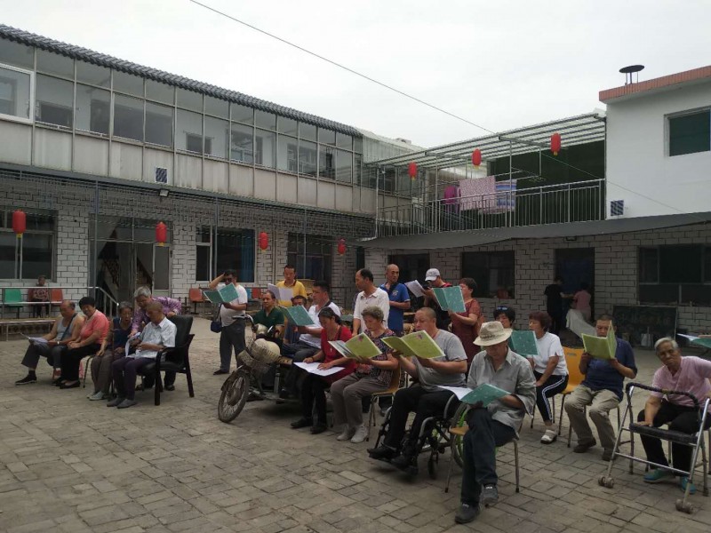 The nursing home's residents sang hymns with the volunteers on June 16, 2018. 