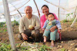 Elder Hou with his wife and two-year-old daughter