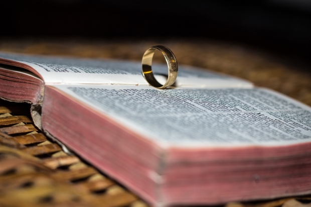 A ring sits on a Bible.