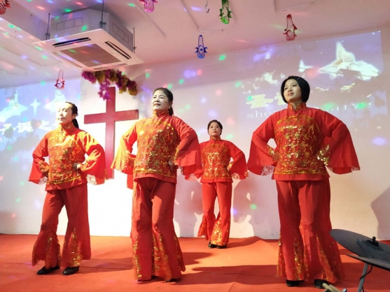 Women danced at the Christmas party held by Suzhou Grace Church on Dec. 25, 2018. 