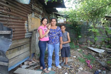 María Socorro Pineda (middle) and her children Evelin Briggith Lopez Pineda (17) and Herson Alfredo Pineda (13) left with a migrant caravan in October but were forced by illness to come back home to H