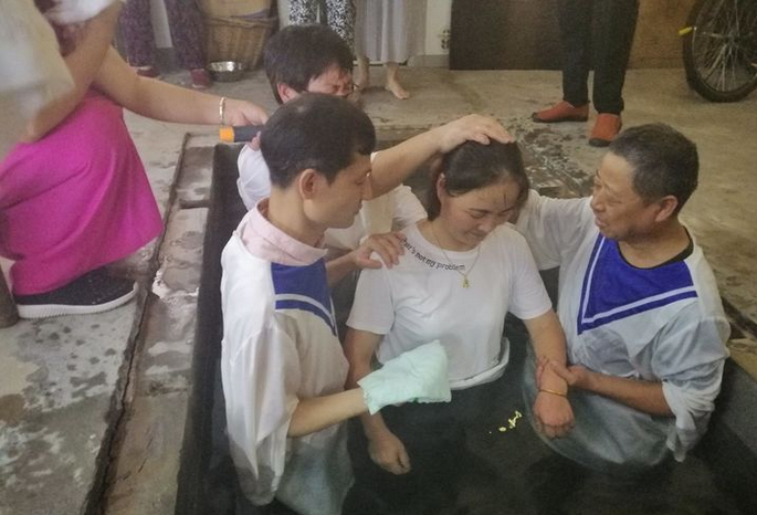 A woman received baptism in Gospel Church, Lin'an District, Hangzhou, on July 27, 2019. 