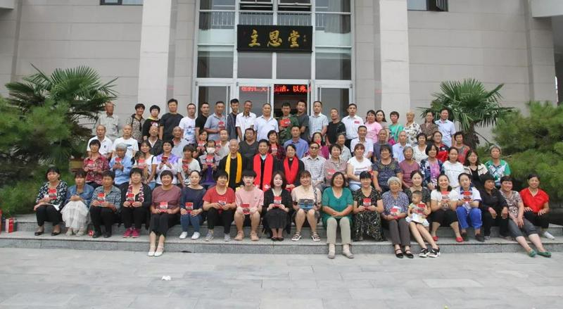 The group photo of the newly baptized members in Zhuen Church