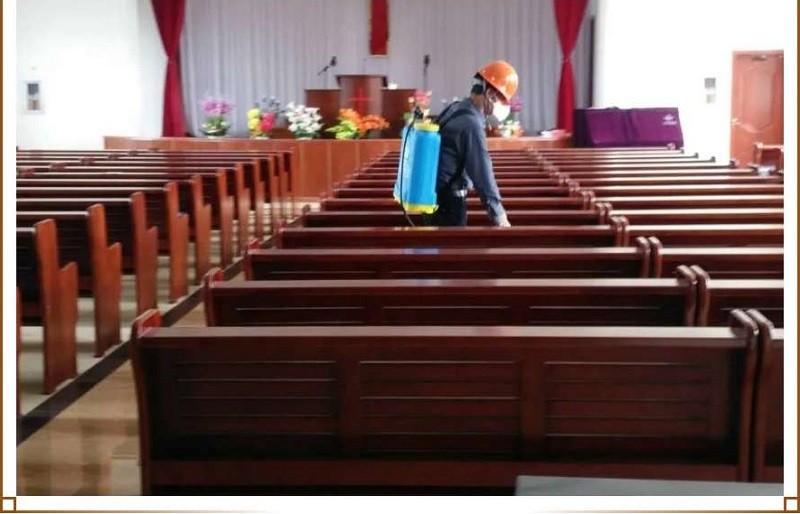 A menber was disinfecting in a church in early June 2020.