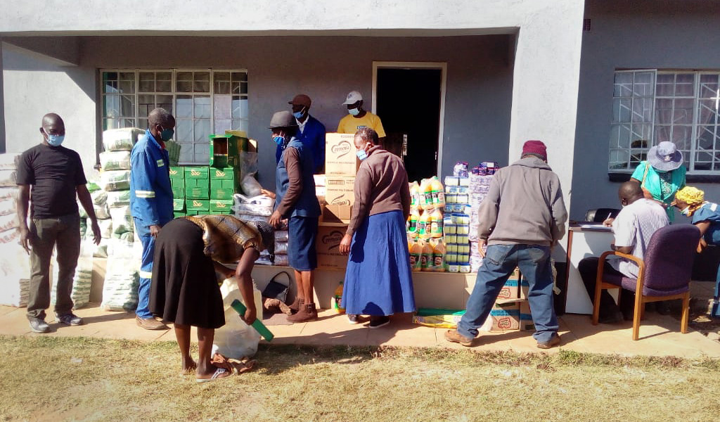 The Nyadire Social Committee distributes food to families at The United Methodist Church’s Nyadire Mission in Mutoko, Zimbabwe. The Nyadire Connection, an all-volunteer group founded by individuals fr