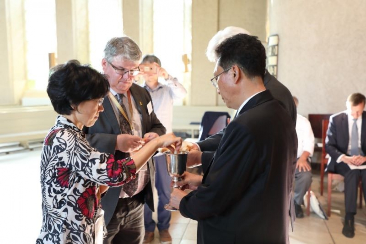 Church representatives from the ROK and DPRK share Holy Communion at a WCC event in Leipzig, Germany, July 2017.