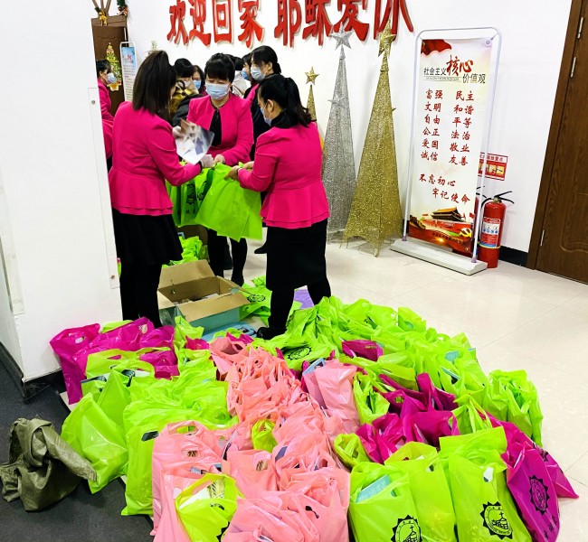 The believers of the Nanzhan Church in Dongfeng County, reveived Christmas gifts after the Christmas eve service held in Nanzhan Church, Liaoyuan, Jilin Province on December 24, 2020. 