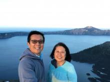 Jiang Peirong and her husband Lin Weiqian pose to take photo.