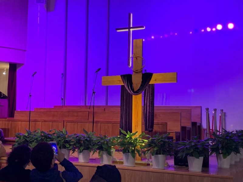 On Aprl 4, 2021, a wooden cross stood on the altar with a crown of thorns and a black gauze in Gospel Church, Pudong New Area, Shanghai. 