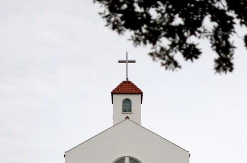 A  church with a white cross.