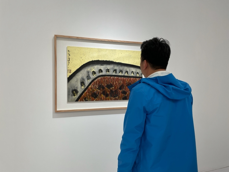 An audience looked at one of Daozi' ink paintings on April 3, 2021. 