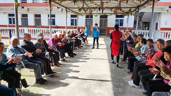 The elderly sing hymns to praise God in Bo’ai Home for the Elderly, under the leadership of Christian caregivers on May 21, 2021. 
