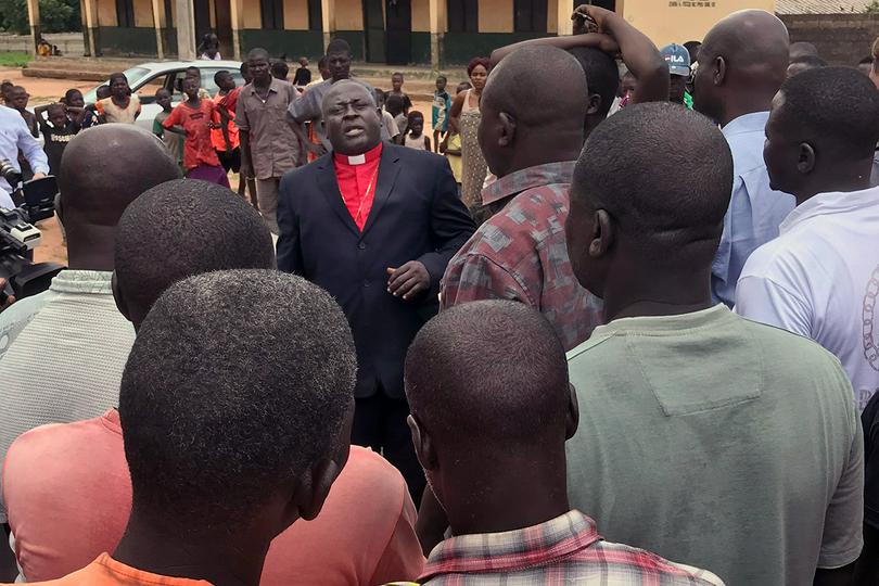 Nigeria Area Bishop John Wesley Yohanna (center) speaks to people at a camp for internally displaced persons in Jalingo, Taraba State, Nigeria, in 2019. 