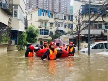 Local rescue workers used kayaks to save people from flooding in Xinxiang, flood-hit Henan in late July 2021. 