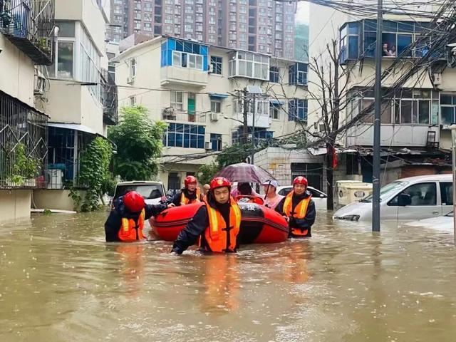 Local rescue workers used kayaks to save people from flooding in Xinxiang, flood-hit Henan in late July 2021.