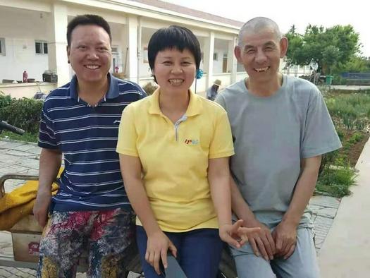 Before his death in Gao Peizhong smiled with two other workers at a leprosy rehabilitation center on July 16, 2019