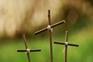 Three little crosses.