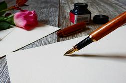 A pen writes on a blank paper.