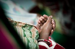 A woman prays.