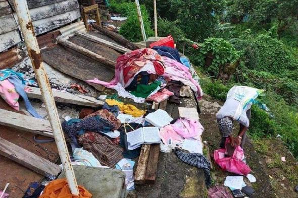 Clothes and books scattered after the Tatmadaw raid on the village of Taal.