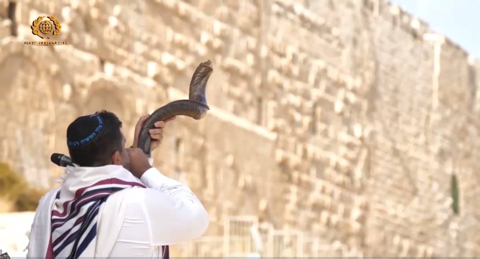 A man blew a shofar to begin the ingathering of the Nations in Jerusalem of the 42nd Sukkot celebration from the Southern Steps, Israel, on September 20, 2021. 