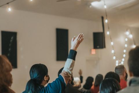 People worship in a house church. 