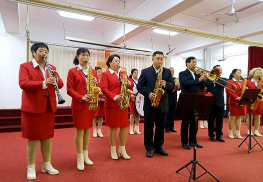 The brass band of Lvhua Street Church in Anshan, Liaoning, played a hymn in an autumn harvest thanksgiving service on Octover 24, 2021.