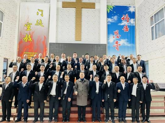Male believers from five branches of Nanzhan Church in Dongfeng County, Liaoyuan, Jilin Province, took a group picuture after a joint Thanksgiving and praise meeting on November 14, 2021.