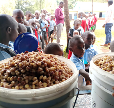 Children waited in line for food in Nyansakia Public Primary School in Kisu County, Kisumo City, Kenya in September 2021. 