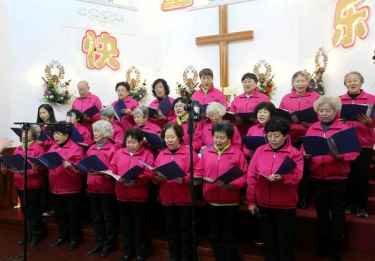 Aged believers sang a hymn during a Christmas service conducted in Yuguang Street Church, Dalian, Liaoning Province, on December 18, 2021.