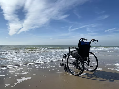 A wheelchair besides the sea