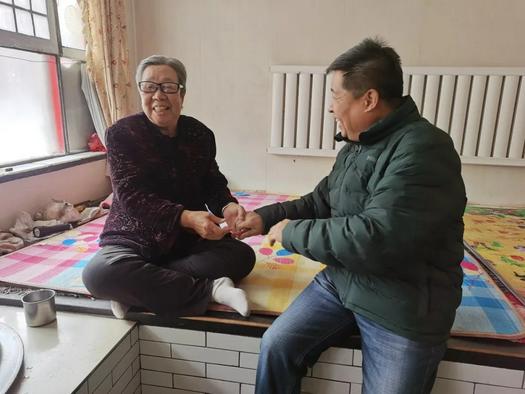 An elderly person was visited by staff of Dongwang Church in Xinfu District, Xinzhou City, Shanxi Province, on January 24, 2022.