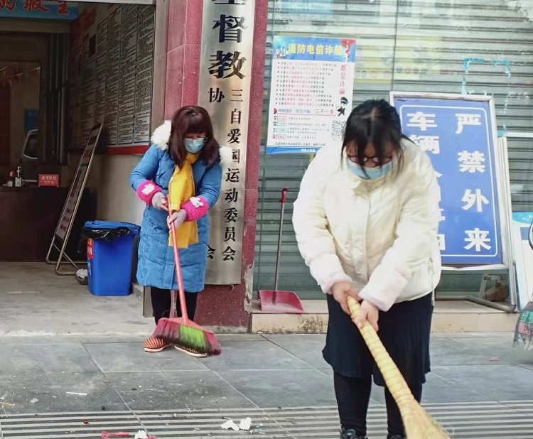 Two church staff cleaned up the place in front of Fangxian CC&TSPM in early March, 2022.