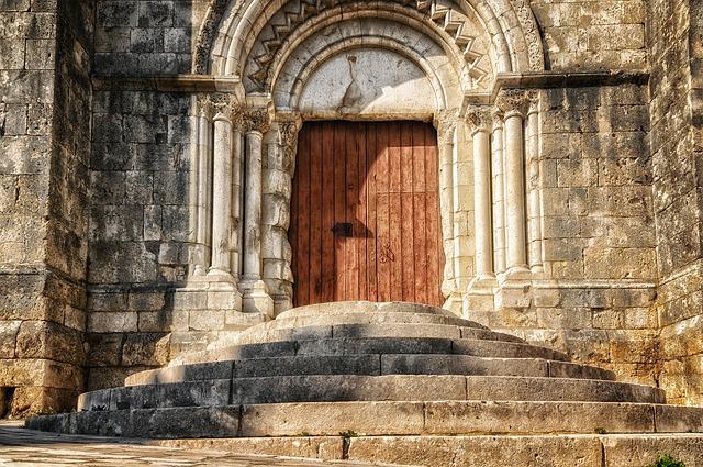 A picture of the closed door of an old church