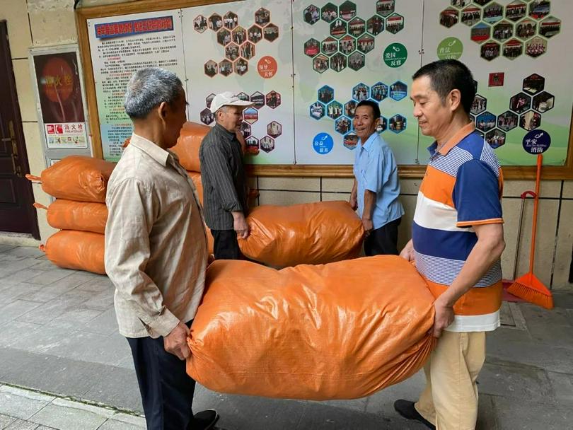 Four male members of Jiaojiang Church in Taizhou, Zhejiang, were carrying packed clothes which were to be shipped to Weinan District in Xi'an, Shaanxi, on June 16, 2022.