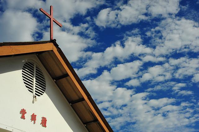 A cross on the roof of a church