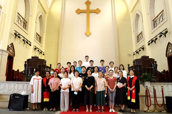 Pastors and new believers took a group picture in Shishan Church, Suzhou, Jiangsu, on July 9, 2022.