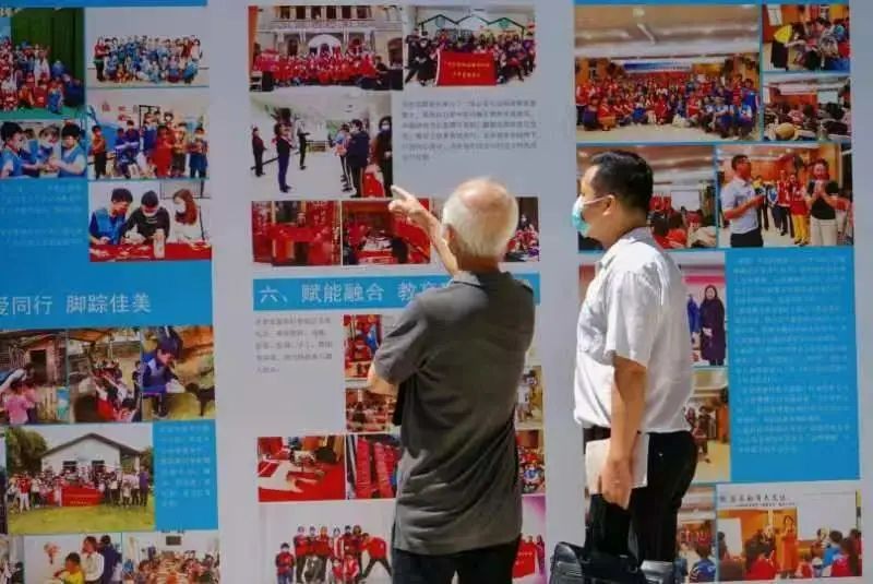 Two believers watched the charity achievement photo exhibition in Guangxiao Church, Guangzhou, Guangdong, on August 7, 2022. 